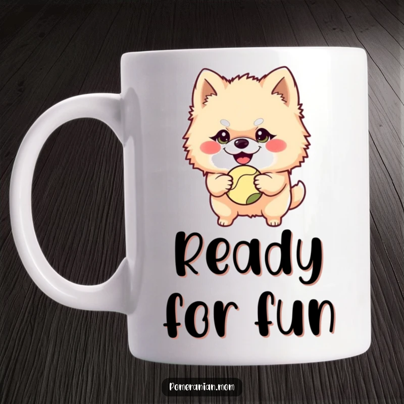 Funny Pomeranian character with a mischievous grin holding a ball on this mug, anticipating playtime with delightful eagerness.
