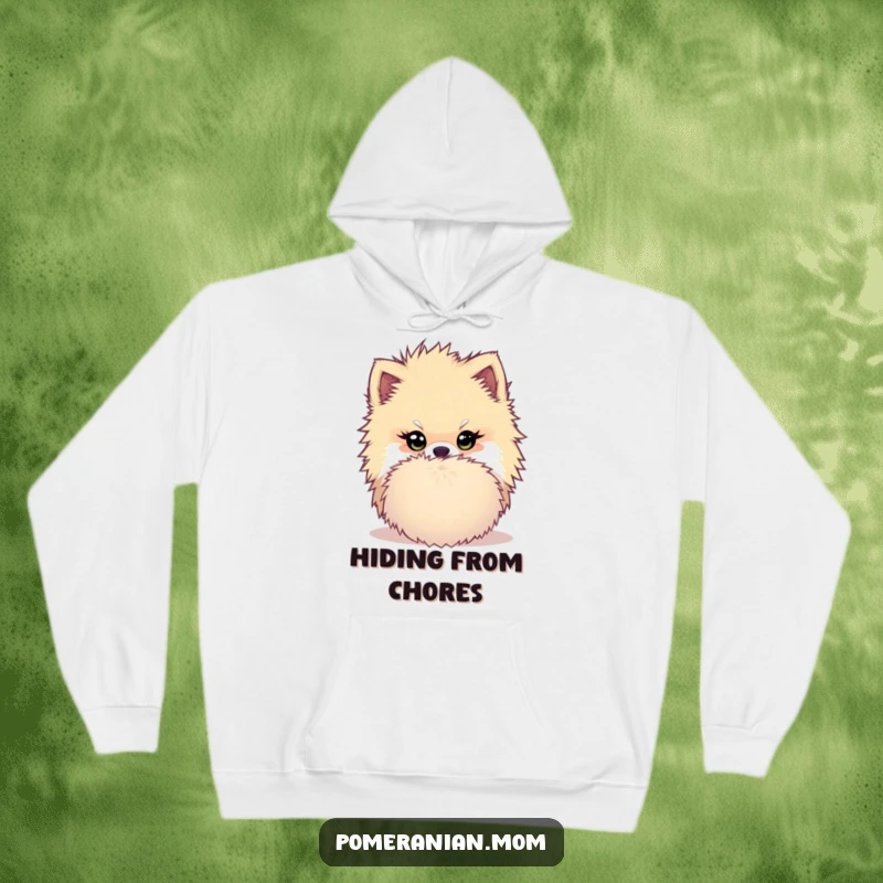 Funny Kawaii Pomeranian Hoodie: Dog hiding behind a pom-pom with a mischievous twinkle, exuding playful humor and cozy charm.