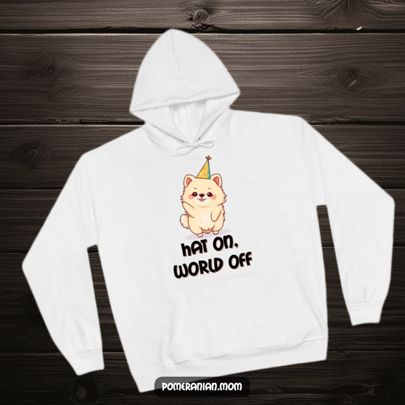 Funny kawaii Pomeranian hoodie, a cozy hoodie with a cute dog balancing a festive party hat. Warm and celebratory.