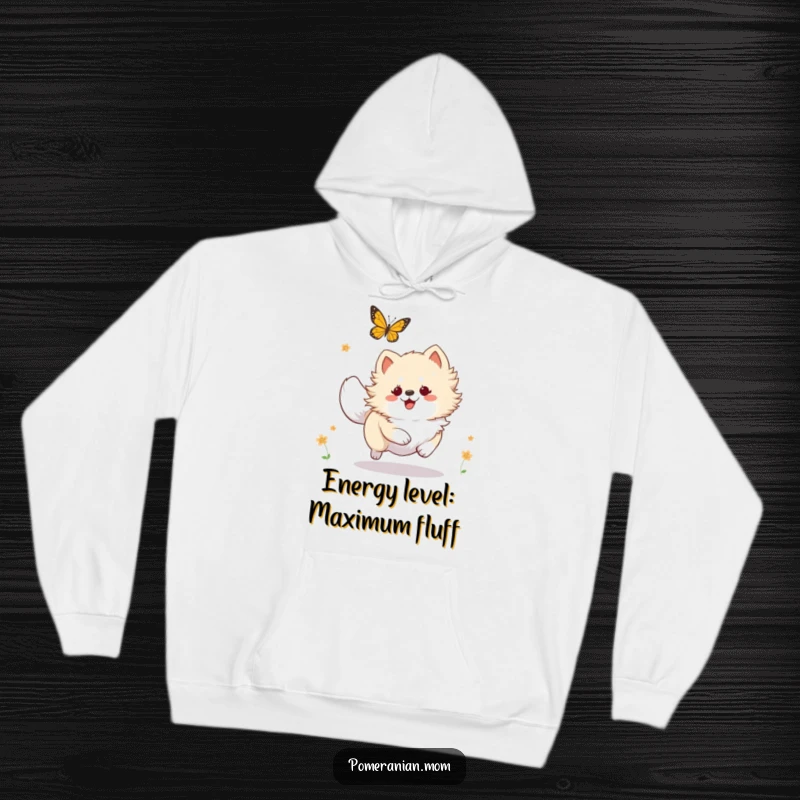 Funny Kawaii Pomeranian hoodie, depicting a fluffy dog playfully pursuing a butterfly with energetic, happy abandon.