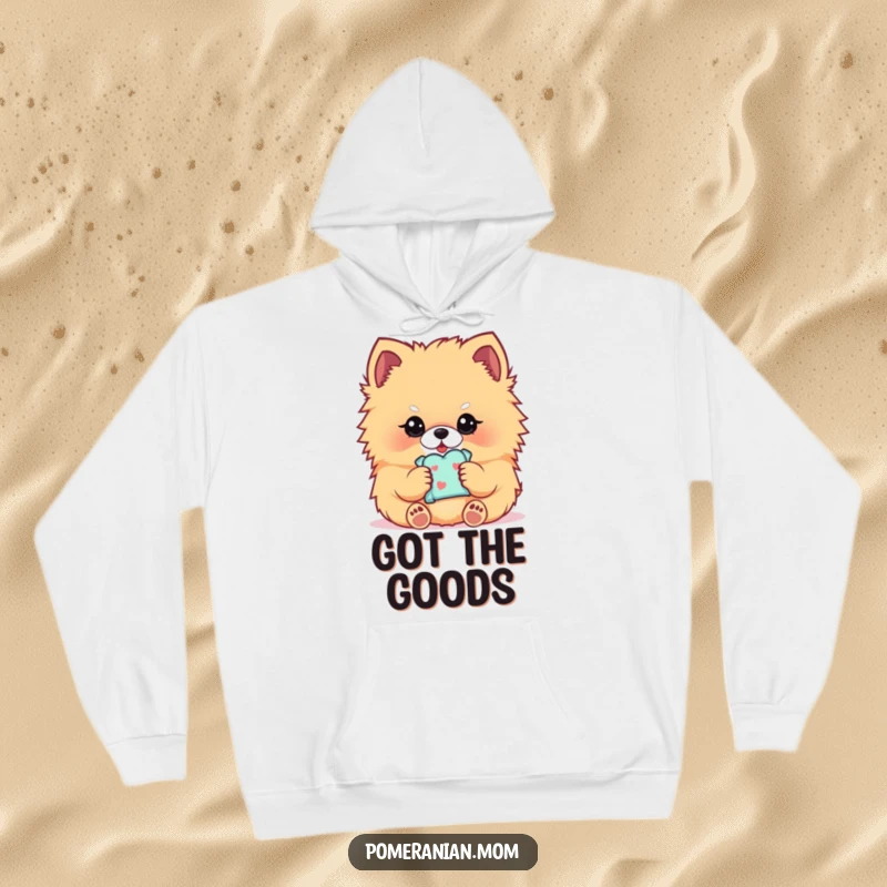 Funny Kawaii Pomeranian hoodie, featuring a fluffy dog delicately holding a treat, cozy and sweet.