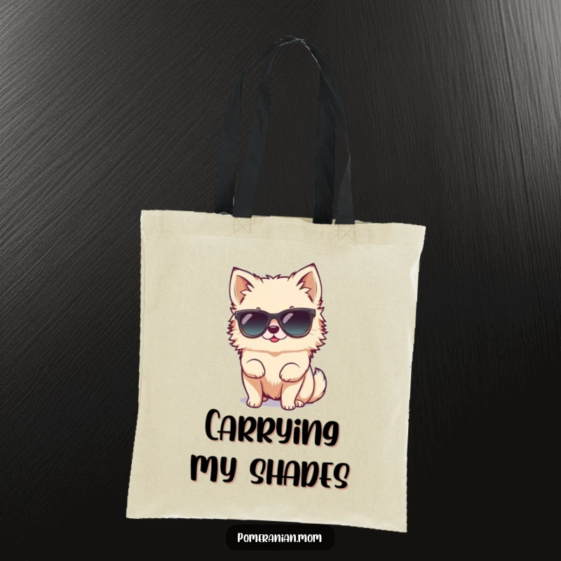Funny tiny Pomeranian character hilariously attempting to wear oversized sunglasses on this durable tote bag, showing off its cool and comical style.