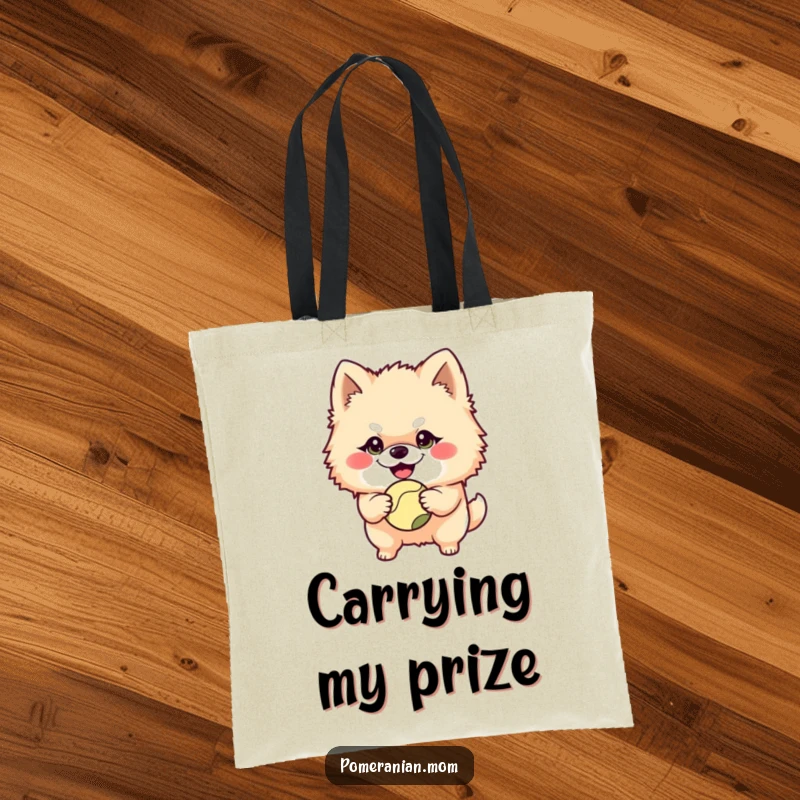 Funny Pomeranian character with a mischievous grin holding a ball on this durable tote bag, showcasing its playful nature and readiness for games.