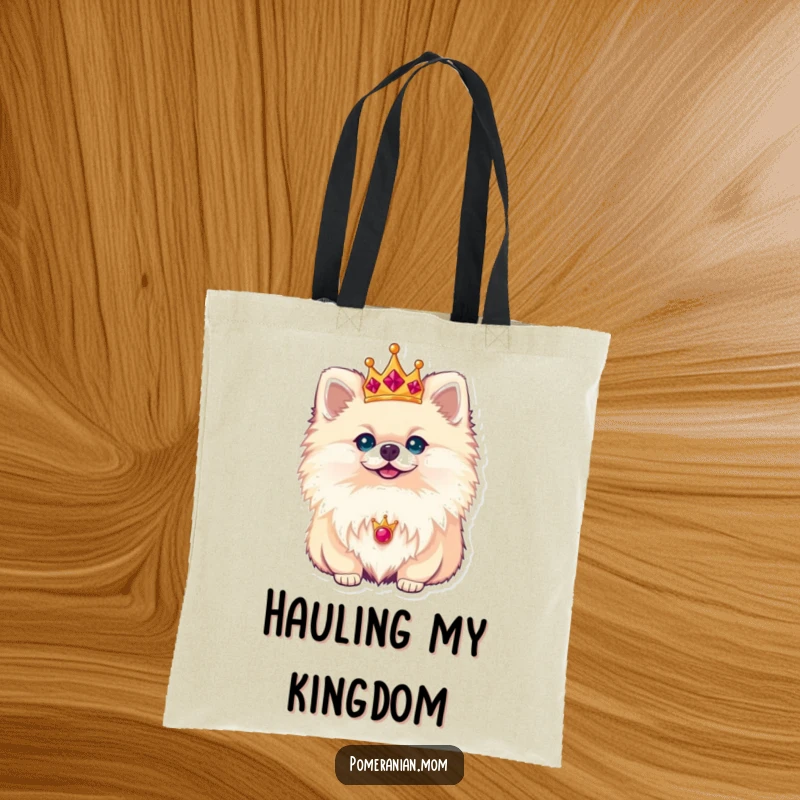 Funny Pomeranian tote bag featuring a small dog wearing a miniature golden crown, looking noble and absolutely adorable.
